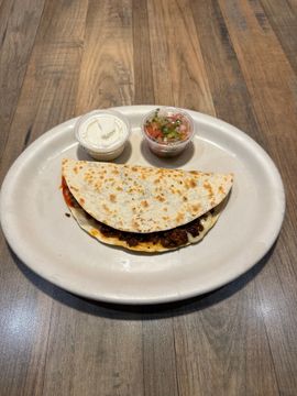 Quesadilla with salsa and sour cream