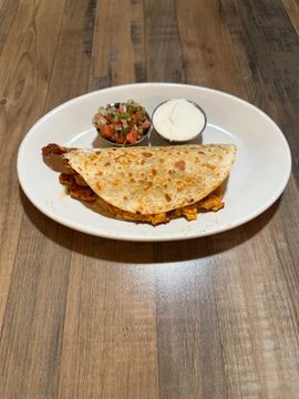 Quesadilla with salsa and sour cream