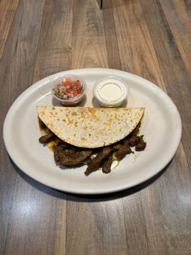 Tortilla taco served with condiments
