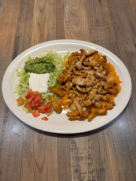 Plate of Mexican food with toppings