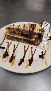 Chocolate cake with whipped cream and drizzle