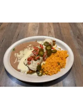 Plate of Mexican food: enchilada, rice, beans