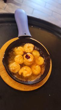 Hot shrimp appetizer in small pan