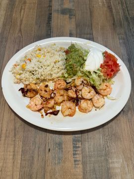 Seafood dish with guacamole and salad