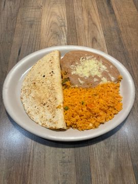 Taco with rice and beans on plate