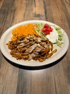 Mexican dish with rice and toppings