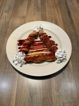 Plate of pastries with decorative cream