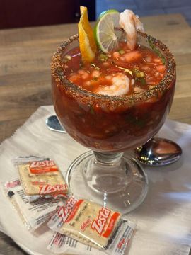 Spicy shrimp cocktail with lemon garnish