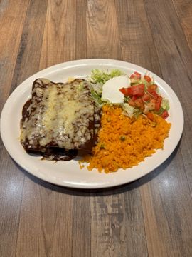 Cheesy enchiladas with rice and salad