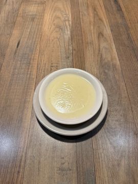 Custard dessert in a white bowl