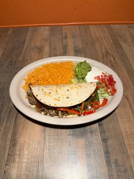 Plate of taco, rice, and guacamole
