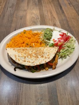 Mexican dish with taco and sides