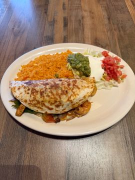 Mexican dish with rice and toppings