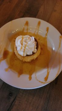 Dessert with whipped cream and caramel drizzle