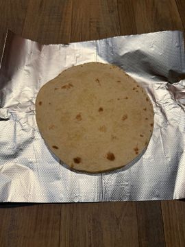 Flatbread resting on foil