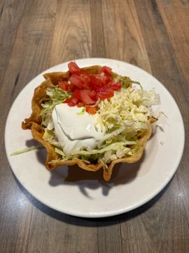 Taco salad bowl with toppings