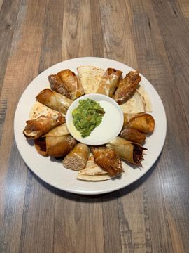 Plate of snacks with guacamole and dip