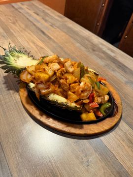 Tropical shrimp dish in carved pineapple