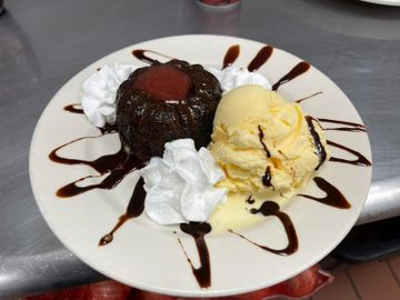 Decadent dessert with whipped cream and chocolate