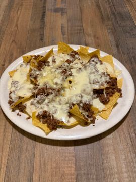 Nachos topped with cheese and beef