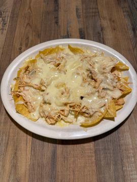 Nachos topped with melted cheese