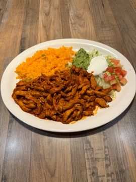 Plate of seasoned meat and sides