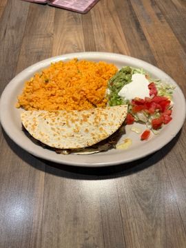 Quesadilla served with rice and toppings