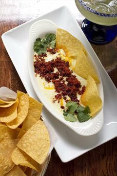 Cheese dip with chorizo and chips