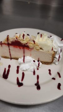 Gourmet cheesecake with whipped cream topping