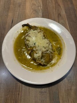 Stuffed pepper with melted cheese and sauce