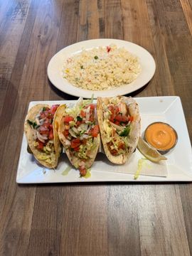 Tacos with rice and dipping sauce