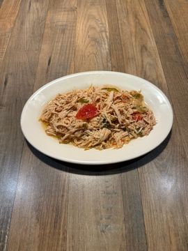 Plate of seasoned shredded chicken