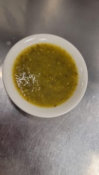Spicy green sauce on metal surface