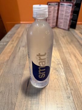 Clear plastic water bottle indoors