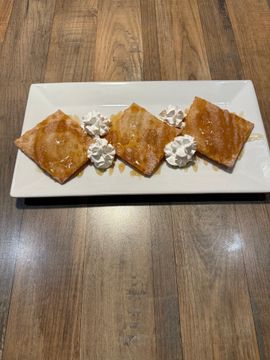 Sweet pastries with cream topping