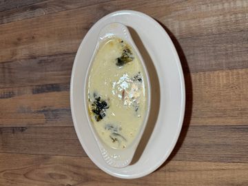 Rich soup served in a white bowl