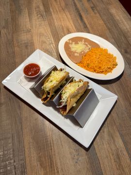 Plate of tacos, beans, and rice