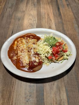 Mexican enchiladas and fresh salad served