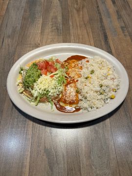 Colorful Mexican dish on wooden table