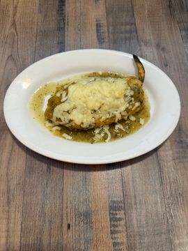 Stuffed pepper with cheese on plate